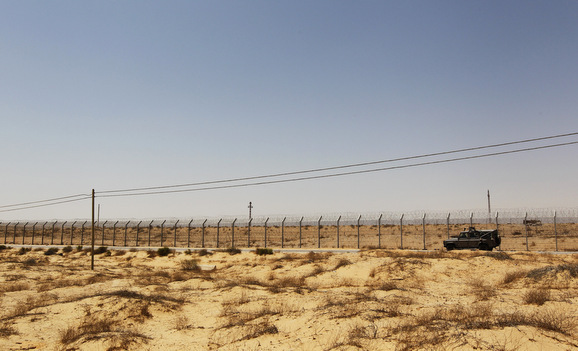 An Israeli military vehicle drives along Israel's border with Egypt's Sinai desert, near the Nitzana crossing