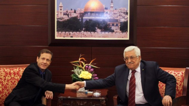 Opposition leader Isaac Herzog meets with Palestinian Authority President Mahmoud Abbas in the West Bank city of Ramallah. December 1, 2013. (Issam Rimawi/Flash90/File)